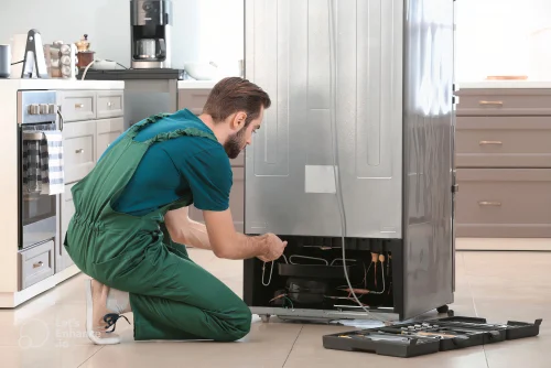Technician repairing an appliance