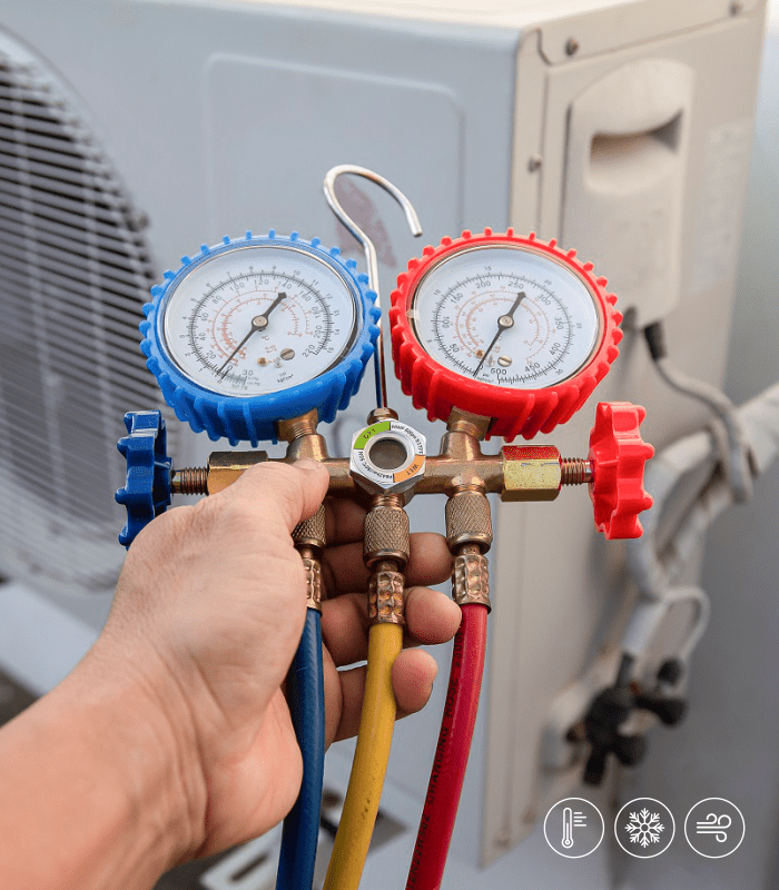 Technician servicing an air conditioner in Hyderabad